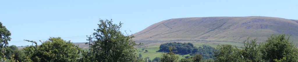 Photograph of Pendle Hill, a dark and high climb.