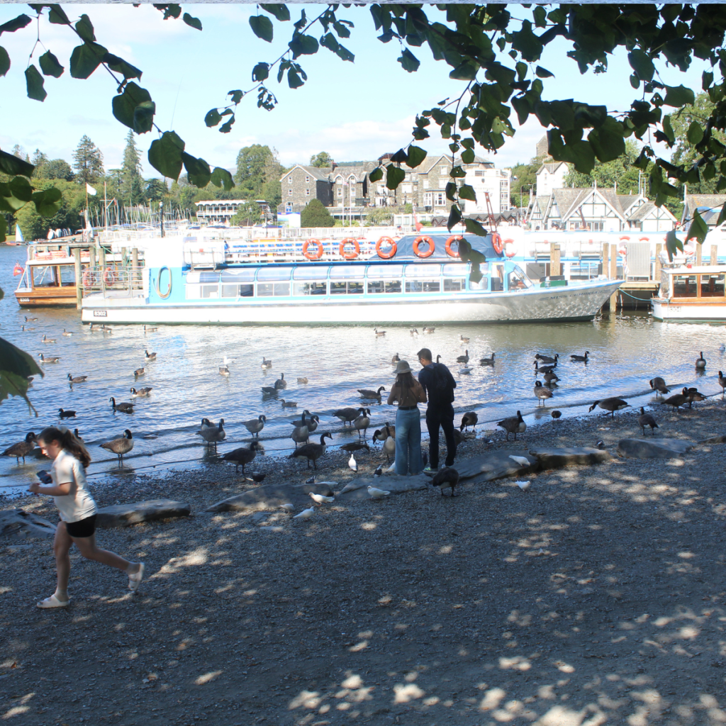 Image of busy harbour at Bowness with boats moored.