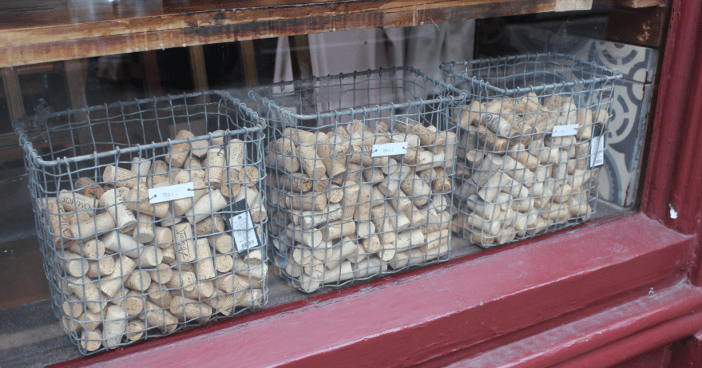 Image of used corks collected into wire baskets in a bar, Manchester Northern Quarter.