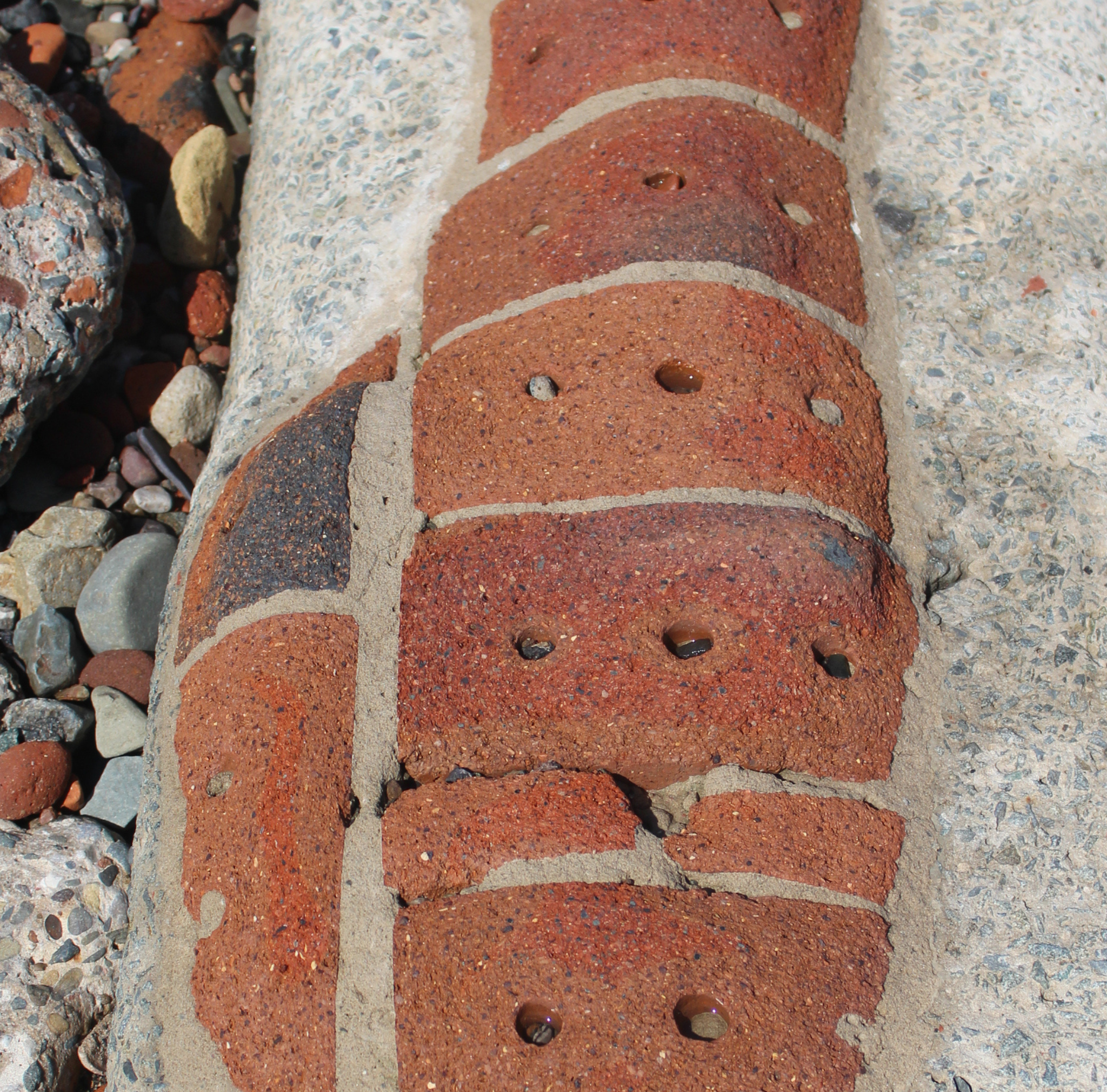 Image of brick work which have been degraded by the sea.