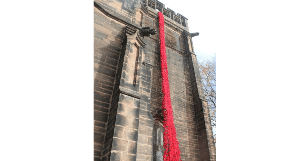 Image of Christ Church with River of Poppies cascading from Bell Tower.