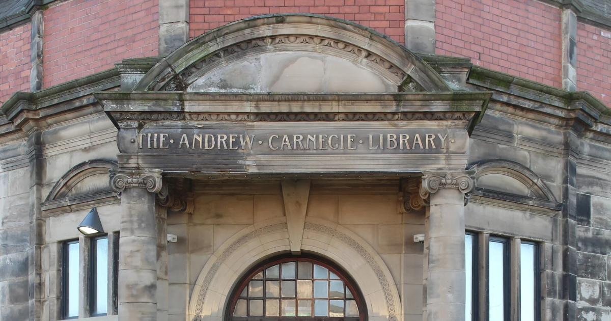 Close up image of the front entrance to the Old Library, featuring the original sign and Andrew Carnegie's name.