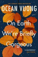 Book cover of “On Earth We’re Briefly Gorgeous” by Ocean Vuong. Deep blue background with white star-like dots and a cluster of autumn leaves in orange and red. Title and author’s name in elegant white text, with a quote from Max Porter: “A masterpiece.” A Sunday Times Bestseller exploring identity, love, and memory through poetic prose.