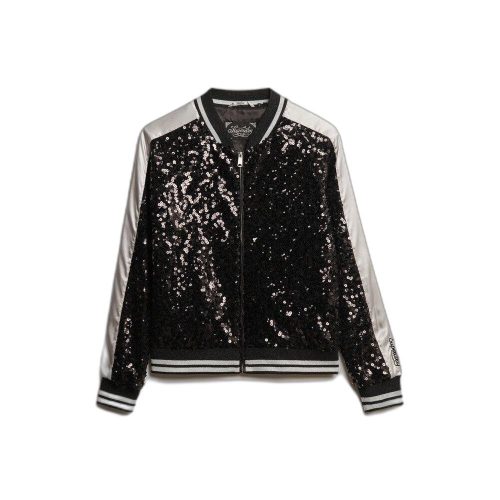 Black and silver sequin bomber jacket with front zipper, ribbed striped cuffs, collar, and hem. Features black sequin panels on front and back, shiny silver sleeves, and “Sincerely Jules for Scunci” label from Superdry. Glamorous yet sporty design ideal for fashion-forward casual wear.