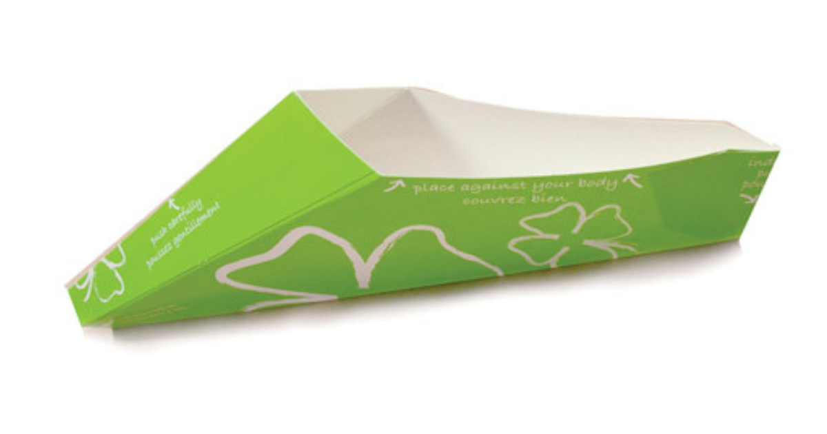 Fold‑up cardboard device designed to give women the ability to pee while standing; shown as a green, disposable, wedge‑shaped funnel with printed instructions on the surface.